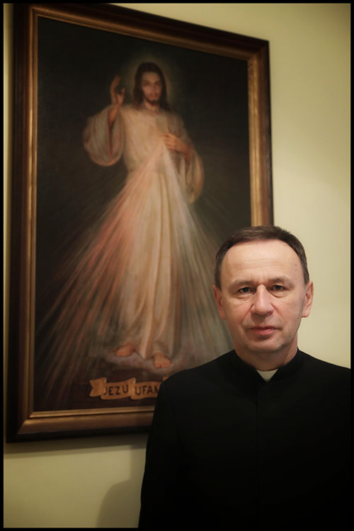 Fr Peter with the Divine Mercy image